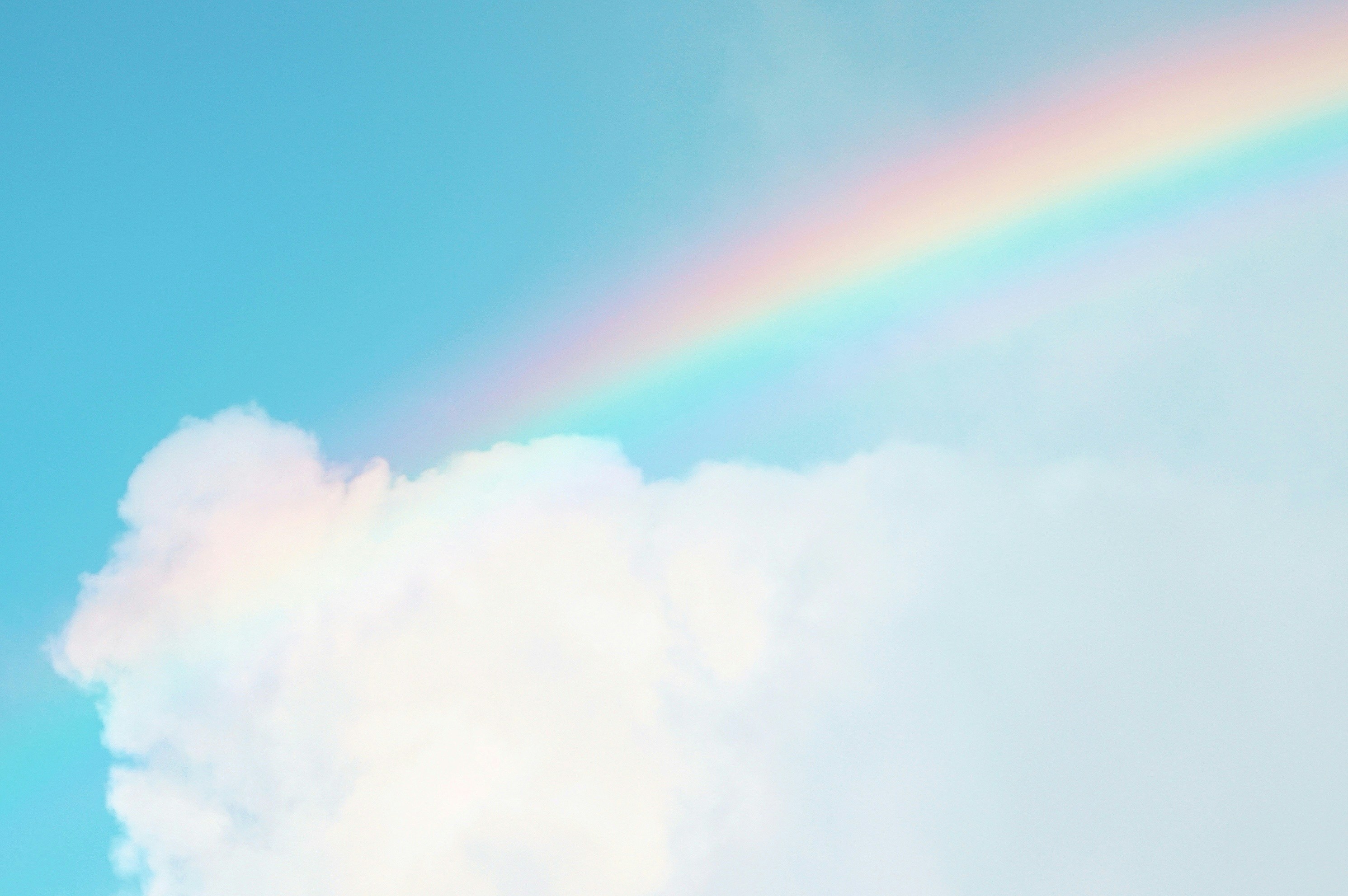Sky with clouds and rainbow